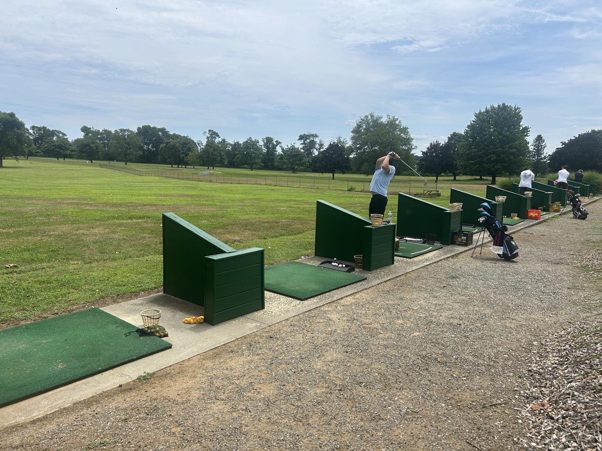 Golfers playing on the driving range